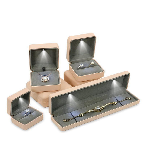 Cajas de joyería LED de cuero para anillo de bodas de regalo de 100 piezas